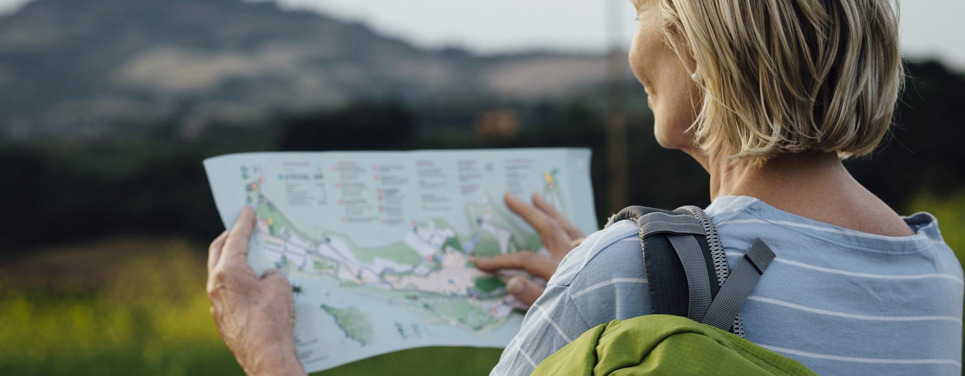 Female Retiree Looking at the Map